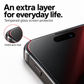 Close-up of the added tempered glass screen protector layer along the rounded edge of a phone display.